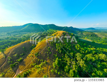 Aerial view mountains land and dry grass in ranong Thailand Aerial view mountains land and dry grass in ranong Thailand 135933965