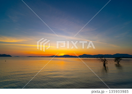 Landscape view of majestic clouds in the sky sunset or sunrise over sea with reflection in the tropical sea,Beautiful cloudscape scenery,Amazing light of nature Landscape nature background 135933985