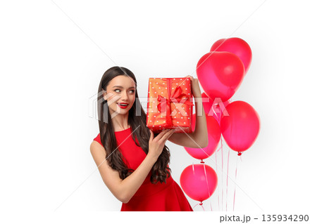 Woman in red dress holding a gift with pink balloons, isolated, PNG Woman in red dress holding a gift with pink balloons, isolated, PNG 135934290