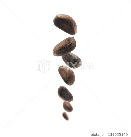 Pine nuts levitate on a white background 135935140