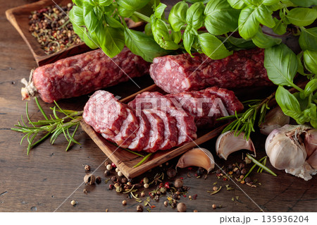 Sliced smoked sausage with herbs and spices. Sliced smoked sausage with herbs and spices. 135936204