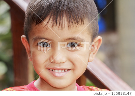 Closeup cute portrait of Asian little boy smiling outdoor Closeup cute portrait of Asian little boy smiling outdoor 135938147