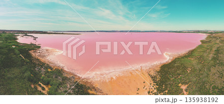 Panoramic view from above of Pink Lake in Torrevieja, Spain, Europe. Salty texture of Pink Lake. Water nature background Panoramic view from above of Pink Lake in Torrevieja, Spain, Europe. Salty texture of Pink Lake. Water nature background 135938192