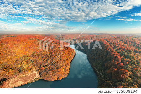 Panoramic view from above of a mountain river and beautiful red mountains in autumn Panoramic view from above of a mountain river and beautiful red mountains in autumn 135938194