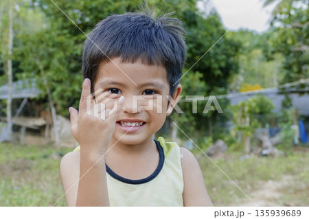 Portrait of Asian little boy playing in park Portrait of Asian little boy playing in park 135939689