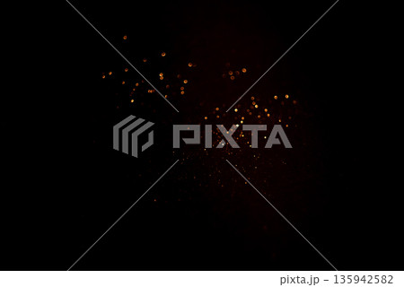 Golden abstract bokeh on black background. Golden abstract bokeh on black background. 135942582