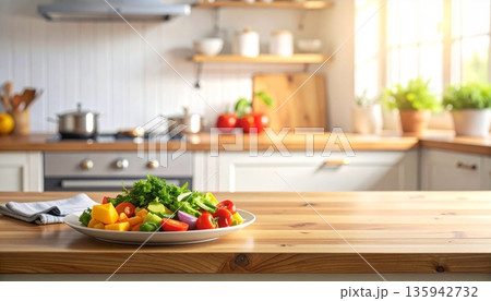 A woman prepares a healthy salad by cutting fresh red tomatoes and green lettuce on a white plate in a bright kitchen interior to cook a nutritious lunch at home 135942732