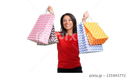 Happy woman holding diverse shopping bags, celebrating a successful sale Happy woman holding diverse shopping bags, celebrating a successful sale 135943772