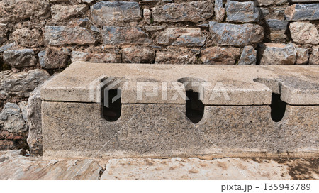 Ancient Roman Public Latrines at Scholastica Baths, Ephesus, Turkey Ancient Roman Public Latrines at Scholastica Baths, Ephesus, Turkey 135943789