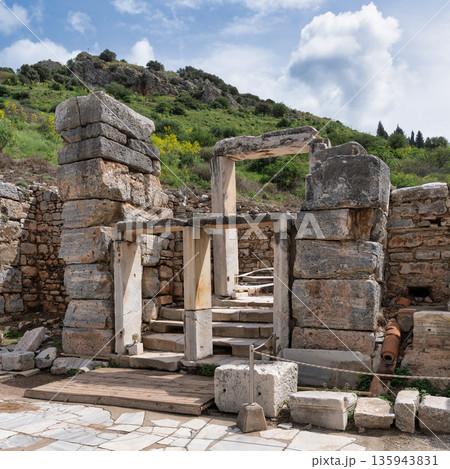 Ancient stone ruins of Ephesus with lush green hills, Selcuk, Turkey Ancient stone ruins of Ephesus with lush green hills, Selcuk, Turkey 135943831