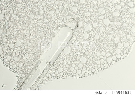 The texture of the foam of shower gel or soap suds or shaving foam. Macrophotography 135946639