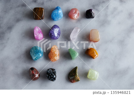 Colorful Polished Gemstones Collection on Marble Background, Flat Lay 135946821