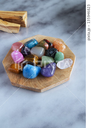 Colorful Healing Crystals Collection on Wooden Plate, Flat Lay 135946823