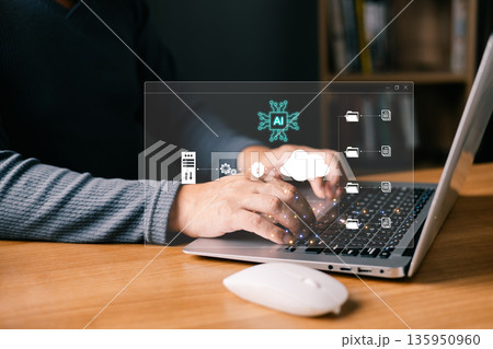 A person typing on a laptop interacts with glowing AI and cloud storage icons, symbolizing artificial intelligence, data management, secure servers, and digital file organization in technology. A person typing on a laptop interacts with glowing AI and cloud storage icons, symbolizing artificial intelligence, data management, secure servers, and digital file organization in technology. 135950960