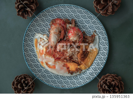 Tasty appetizing garlic Prawns, Shrimps on frying pan with Fried eggs in a frying on a japanese dish. Top View with Copy space. Tasty appetizing garlic Prawns, Shrimps on frying pan with Fried eggs in a frying on a japanese dish. Top View with Copy space. 135951363