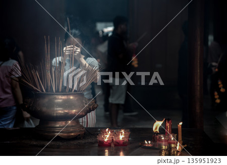 Interesting Asian women experience Thailand religion culture praying at Dragon Temple Kammalawat (Wat Lengnoeiyi), Wat Leng Noei Yi is the most important Chinese Buddhist temple in Bangkok. 135951923