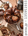 Chocolate marble bundt cake or zebra cake with chocolate glaze sliced on brown table background 135951933