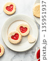 Linzer cookies in shape of heart with jam on white marble background. Mother's day, Valentine's day. Homemade present 135951937
