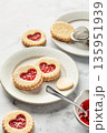 Linzer cookies in shape of heart with jam on white marble background. Mother's day, Valentine's day. Homemade present 135951939