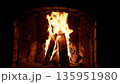 Blazing fire in a stone fireplace 135951980