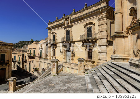 View of a building facade of the baroque town of Modica in the province of Ragusa in Sicily, Italy View of a building facade of the baroque town of Modica in the province of Ragusa in Sicily, Italy 135952225