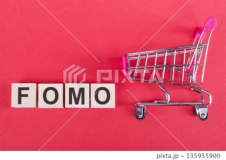 word FOMO cube wood on wooden table background. business concept 135955900