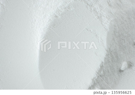 Soda powder sodium bicarbonate surface. Abstract white background. White texture with wavy patterns top view 135956625