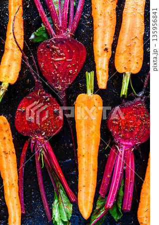 Seasoned carrots and beetroot coated with oil Seasoned carrots and beetroot coated with oil 135956841