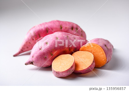Whole and sliced sweet potato on white background 135956857