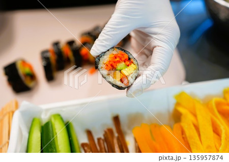Korean Kimbap: The Culinary Process of Rolling and Slicing Gimbap Korean Kimbap: The Culinary Process of Rolling and Slicing Gimbap 135957874