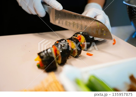 Korean Kimbap: The Culinary Process of Rolling and Slicing Gimbap Korean Kimbap: The Culinary Process of Rolling and Slicing Gimbap 135957875