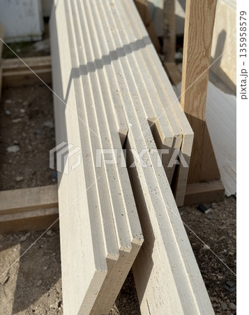 Stack of cut stone slabs in a construction site, ideal for texture background Stack of cut stone slabs in a construction site, ideal for texture background 135958579