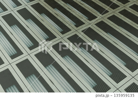 Industrial metal grid floor with illuminated rectangular patterns Industrial metal grid floor with illuminated rectangular patterns 135959135