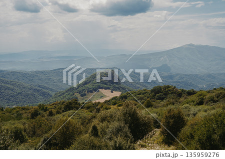 Explore nature in the mountains of Georgia with clouds and green hills in summer Explore nature in the mountains of Georgia with clouds and green hills in summer 135959276