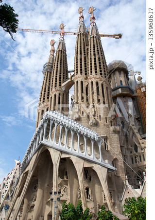 Barcelona, Spain, August 30, 2017: Sagrada Familia under construction with crane Barcelona, Spain, August 30, 2017: Sagrada Familia under construction with crane 135960617