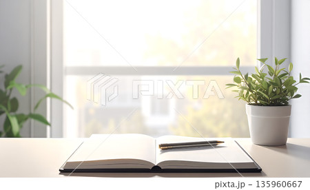 窓辺に置かれた観葉植物とノート|自然光あふれるシンプルなデスク 窓辺に置かれた観葉植物とノート|自然光あふれるシンプルなデスク 135960667