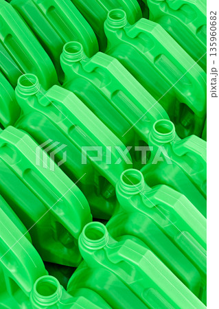 Empty green plastic canisters for technical fluids - motor oil, antifreeze, etc. 135960682
