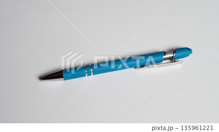 Blue Pen On White Desk Surface, Sleek Plastic Barrel With Chrome Clip, Retractable Tip Casting Soft Shadow, Bright Studio Lighting, Minimalist Composition Suggesting Writer Tools For Notes Blue Pen On White Desk Surface, Sleek Plastic Barrel With Chrome Clip, Retractable Tip Casting Soft Shadow, Bright Studio Lighting, Minimalist Composition Suggesting Writer Tools For Notes 135961221