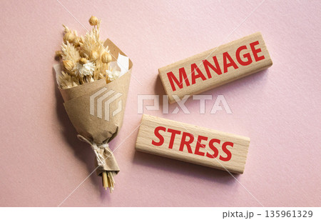 Manage stress symbol. Concept word Manage stress on wooden blocks. Beautiful pink background with bouquet of flowers. Business and Manage stress concept. Copy space Manage stress symbol. Concept word Manage stress on wooden blocks. Beautiful pink background with bouquet of flowers. Business and Manage stress concept. Copy space 135961329