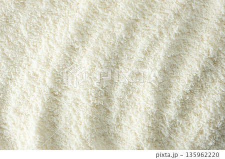 Background texture of white desiccated coconut flakes top view 135962220