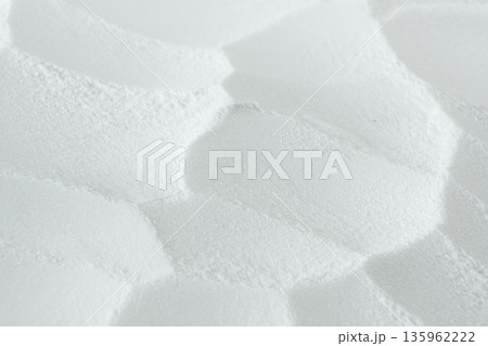 Soda powder sodium bicarbonate surface. Abstract white background. White texture with wavy patterns top view 135962222