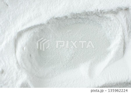 Soda powder sodium bicarbonate surface. Abstract white background with space for text. 135962224