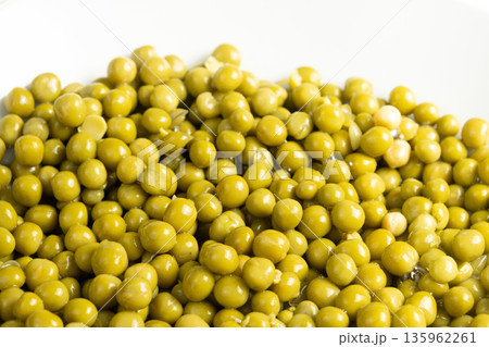 Macro view of many round green peas, canned product Macro view of many round green peas, canned product 135962261