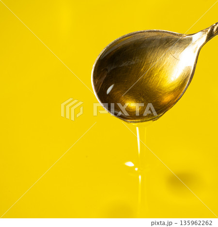 Unrefined Olive Oil Flowing From Spoon, Square Photo, Oil Texture Macro 135962262