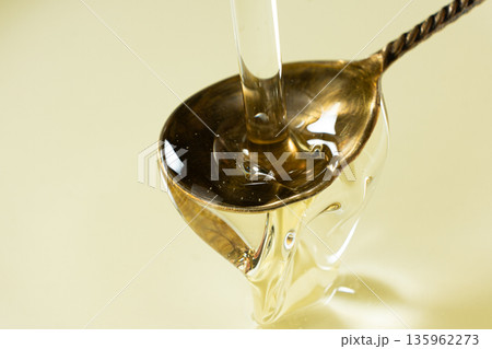 Refined Vegetable Oil Pouring, Spoon Close-Up. Refined Vegetable Oil Pouring, Spoon Close-Up. 135962273