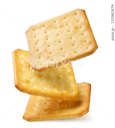 Square crackers falling close-up on a white. Isolated Square crackers falling close-up on a white. Isolated 135962674
