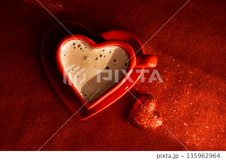 Heart Shaped Coffee Cup with Tulips on Bed. Romantic Valentines Day Celebration Heart Shaped Coffee Cup with Tulips on Bed. Romantic Valentines Day Celebration 135962964