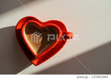 Heart Shaped Red Coffee Cup on White Background. Romantic Still Life for Valentines Day Heart Shaped Red Coffee Cup on White Background. Romantic Still Life for Valentines Day 135962965