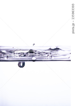 200.Suspended Droplet Below Rippling White Water Surface 135963393