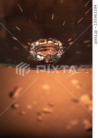 195.Crown Splash with Amber Background and Ripples 195.Crown Splash with Amber Background and Ripples 135963394